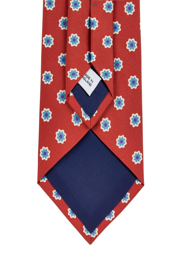 A Roderick Charles silk flower tie in wine.