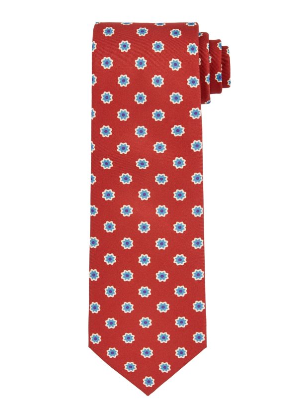 Silk men's tie in dark red or wine coloured with small flower pattern.