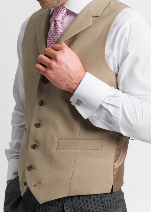 A traditional tan formal waistcoat worn with morning suit to weddings or races.