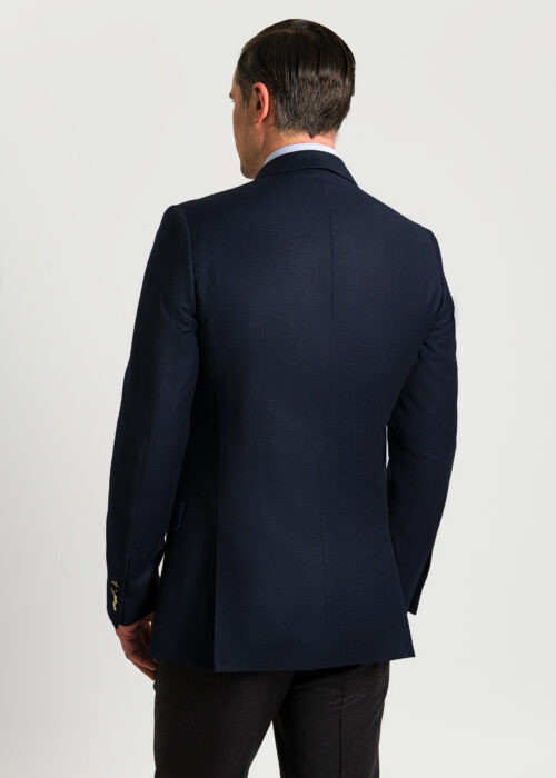 Back of a flannel double breasted men's blazer in navy.