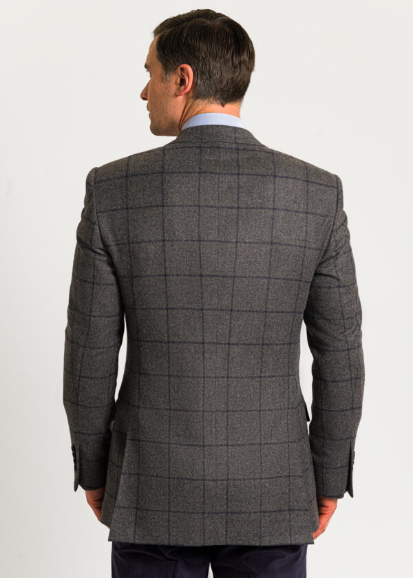 Back look of a men's grey tweed jacket with blue overcheck.