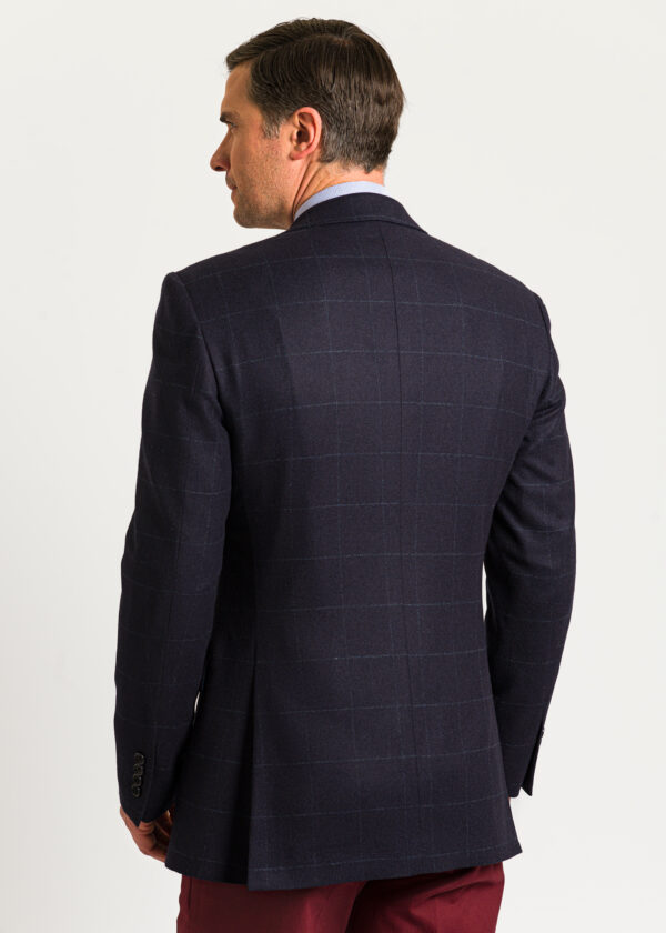 Back of a men's navy tweed jacket in a modern tailored fit.