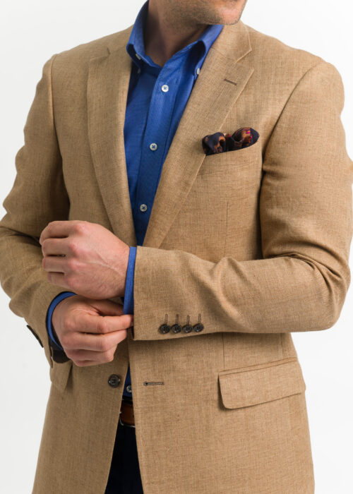 It's all about the details, 4 button cuff on a tailored fit tan herringbone jacket and beautiful pocket square.