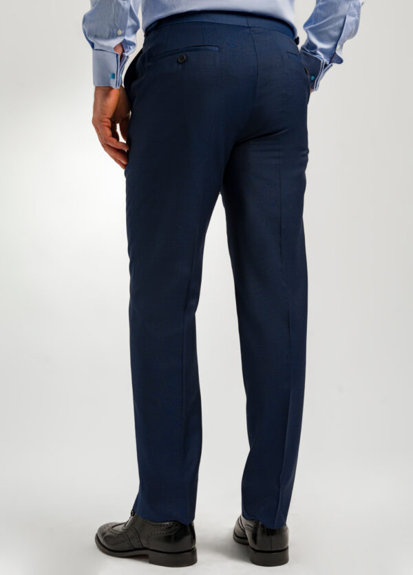 The back of a pair of men's dark blue semi plain suit trousers.