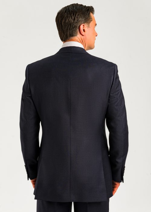 The back of a Roderick Charles men's blue microcheck suit, showing an elegant silhouette.