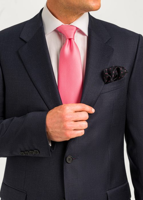 A detail shot of a Roderick Charles classic fit microcheck blue suit, showing it's four button cuff sleeves.