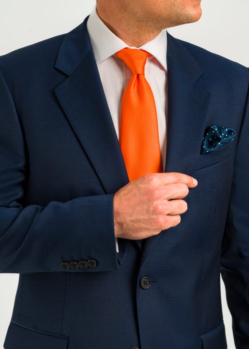 Roderick Charles dark blue classic fit suit with orange tie smart wear