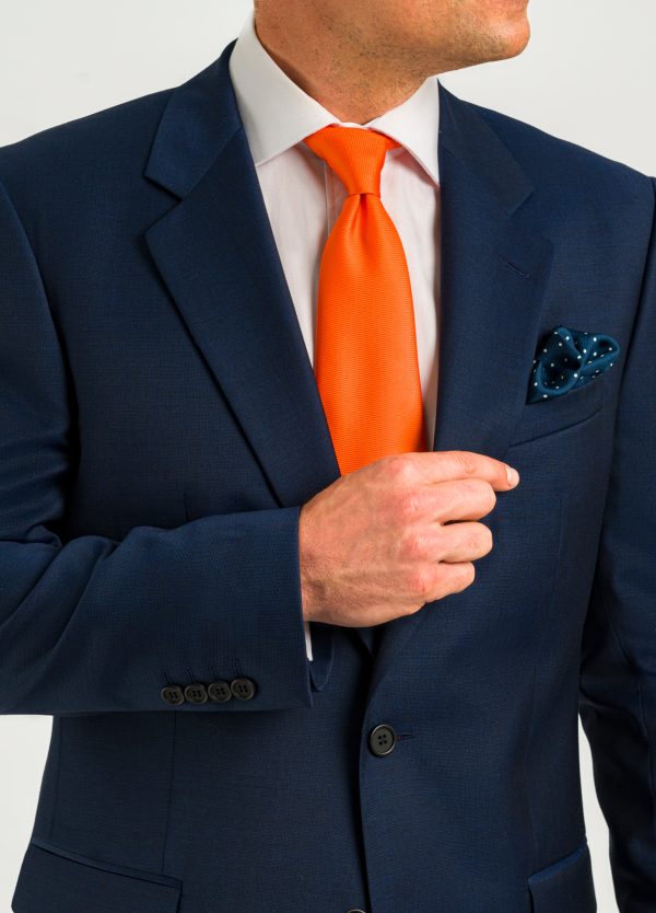 Roderick Charles dark blue classic fit suit with orange tie smart wear