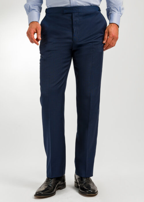 The front of a pair of men's dark blue semi plain suit trousers.