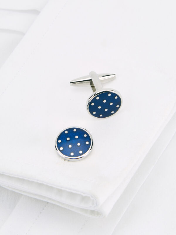 A Roderick Charles royal blue round spot cufflink