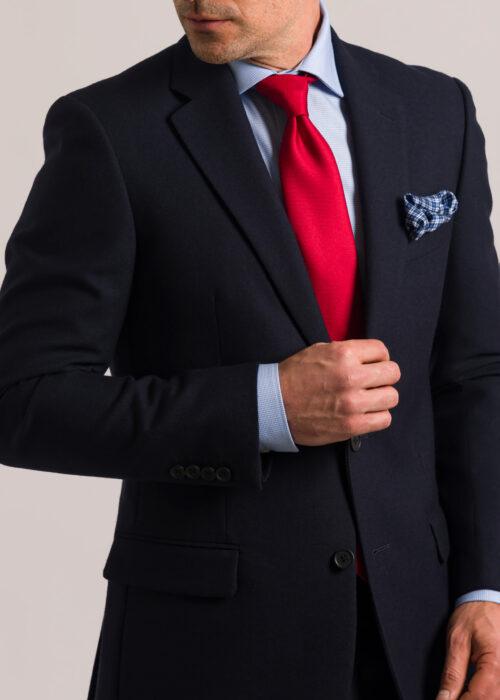 A contemporary Roderick Charles tailored fit navy hopsack suit, showcased with a red silk tie and a blue silk pocket square