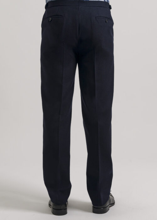 The back of slim-fit trousers from a classic tailored navy hopsack suit