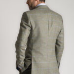 The back of a Roderick Charles tweed jacket, showing the bright sky and pink windowpane check