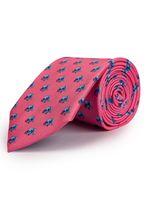 A rolled up Roderick Charles pink silk tie with elephants