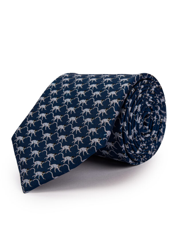 A rolled up Roderick Charles navy silk monkey tie