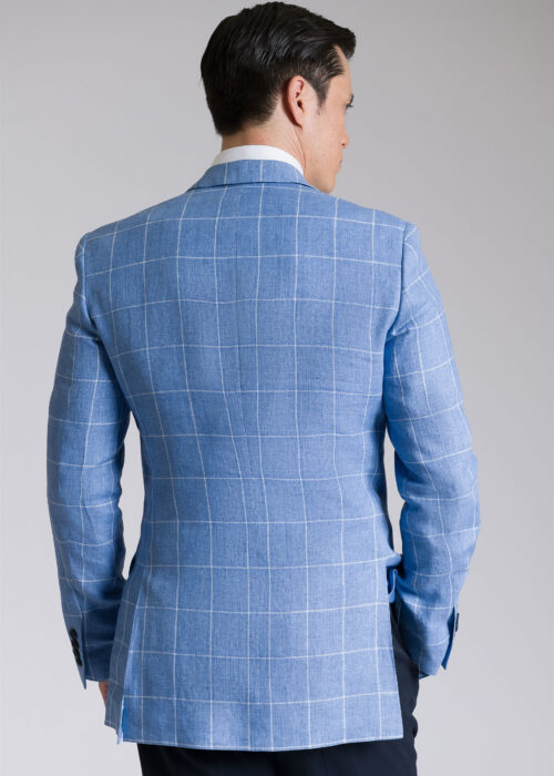 The sleek look of the back of a Roderick Charles lightweight tailored fit sky blue windowpane linen jacket