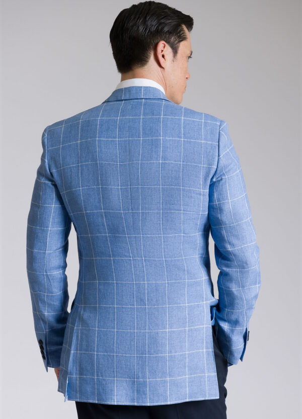 The sleek look of the back of a Roderick Charles lightweight tailored fit sky blue windowpane linen jacket